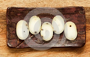 Produce of Spain - stick of hard goat cheese with whole plack peppercorns