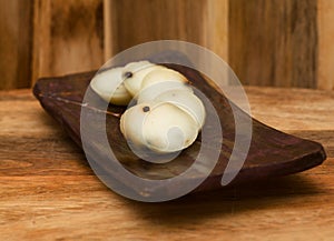 Produce of Spain - stick of hard goat cheese with whole plack peppercorns