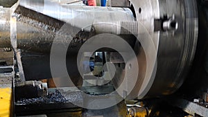 Producing derrick equipment, close-up. CNC Lathe Machinemakes Metal Detail on Factory. detail rotating. Turning lathe at