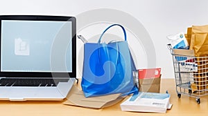 Product package boxes and shopping bag in cart with laptop computer