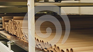 Production of cardboard packaging. Cardboard moves out of the machine.