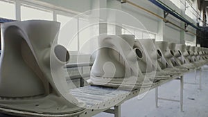 Production of ceramics, view of ceramic products sinks and toilets, conveyor.