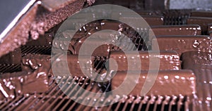 Production of chocolate waffles. Automated chocolate waffle baking line at a confectionery factory.