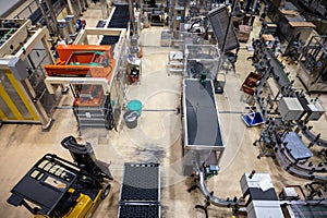 Production of cremant sparkling wine in Burgundy, France. Automatically powered bottling lines on factory