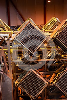 Production of cremant sparkling wine in Burgundy, France. Automatically powered riddling remuage boxes on factory