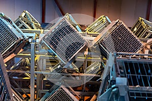 Production of cremant sparkling wine in Burgundy, France. Automatically powered riddling remuage boxes on factory