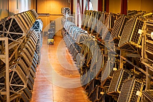 Production of cremant sparkling wine in Burgundy, France. Automatically powered riddling remuage boxes on factory