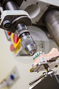 Production dentures drill in action