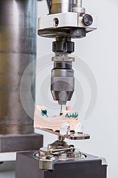 Production dentures drill in action