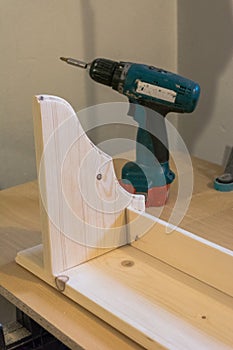 Production of handmade wooden pelmet, view with drill