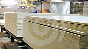 Production of laminated fiberboard. Fibreboard sheets for furniture production photo