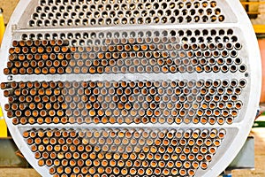 Production of a large tube bundle for a shell-and-tube heat exchanger in an industrial production room of a shop with equipment