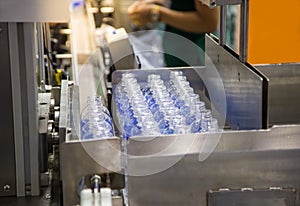 Production line collecting empty plastic bottle from blowing machine