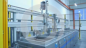 Production line with movable conveyor machine. Industrial equipment at factory