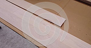 Production line of the wooden floor factory. Industrial background