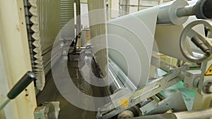 Production line, workshop or conveyor for the manufacture of lamination for fiberboard, chipboard, paper, film, plastic