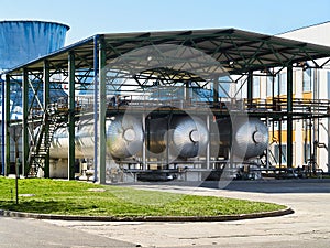 Production of liquefied carbon dioxide of carbonic acid part of chemical plant three cryogenic tanks with CO2 under canopy that photo