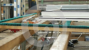 Production and manufacturing of plastic windows pvc, on the table lies the sash window, screwdriver, the shop is