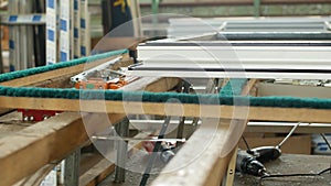 Production and manufacturing of plastic windows pvc, on the table lies the sash window, screwdriver, the shop is