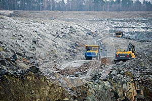 Production Mining of granite stone by quarrying machines in Mikashevichi