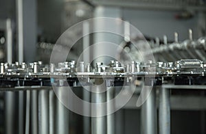 Production of plastic bottles of mineral water lemonade. spilling water bottles. assembly-line production environmentally friendly