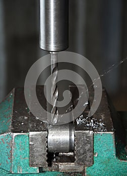 Production site, the drilling machine in work