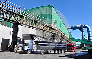 Production of steel in a steel mill - production in heavy indust - outside view with truck photo