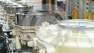 Production washing machine drums on automatic equipment at factory