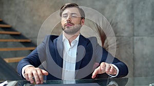 Productive businessman relaxing after work on laptop. Guy closing computer.