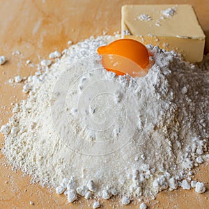 Products for dough, flour, sugar and eggs on the board