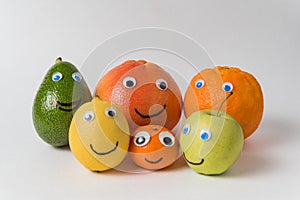 Products with funny faces Googly eyes and painted smiles. Different nationalities concept