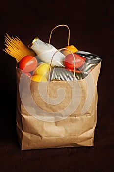 Products in a paper bag on a brown linen background