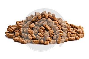 Products for pets isolated on white background. An armful of dry food for dogs, cats close-up.
