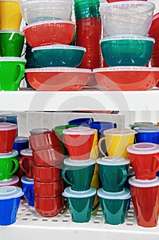 The products of plastic ware, subjects of care of plants on display in a supermarket. Replacement of disposable tableware