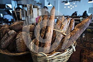 products for sale. A colorful showcase of genuine Bakery with assortment of breads baguette,\