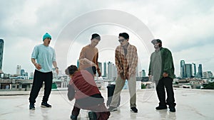 Profession break dancer practice B-boy dance with friends at roof top. hiphop.