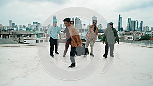 Profession break dancer practice B-boy dance with friends at roof top. hiphop.