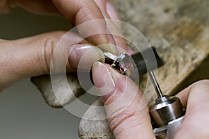 Profession jeweler. Craft jewelery making. Hands of a jeweller . Handwork . Close up.