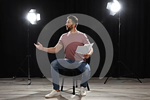 Professional actor rehearsing on stage in theatre