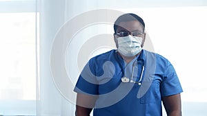 Professional african american medical doctor working in hospital office. Medicine and healthcare.