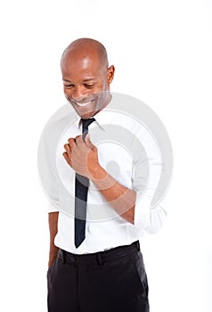 Professional african man with hand on his tie