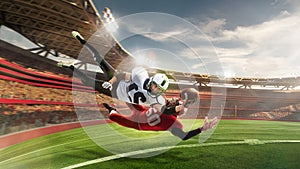 Professional american football players in motion and action with ball during match over 3 D model of grand arena