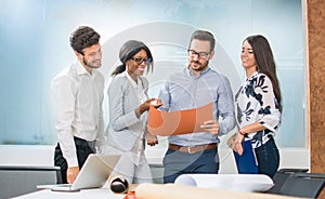 Professional architects discussing the project in office.