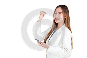 professional Asian business woman in a white suit smiles happily successful while holds smartphone isolated on white background