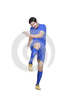 Professional asian footballer kick the ball