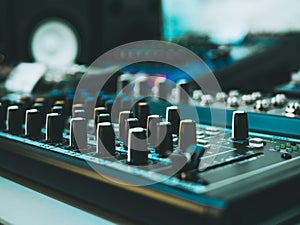 Professional audio equipment with faders knobs and buttons