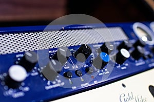 professional audio mixer and amplifier with different knobs for