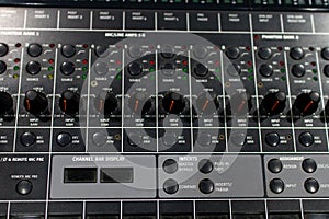 professional audio mixer and amplifier with different knobs for