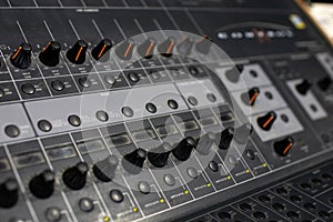 professional audio mixer and amplifier with different knobs for