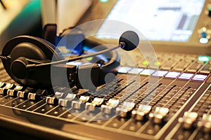 Professional audio Mixer and Professional Headphones in the Recording Studio. Sound Mixing Desk. Sound Mastering For Radio and TV